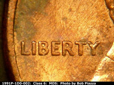 Die-stage B marker on 1991P•1DO•002 (1991 Doubled Die Obverse).