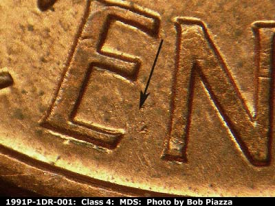Die-stage B marker on 1991P•1DR•001 (1991 Doubled Die Reverse).