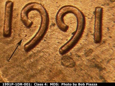 Die-stage B marker on 1991P•1DR•001 (1991 Doubled Die Reverse).
