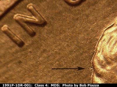 Die-stage B marker on 1991P•1DR•001 (1991 Doubled Die Reverse).