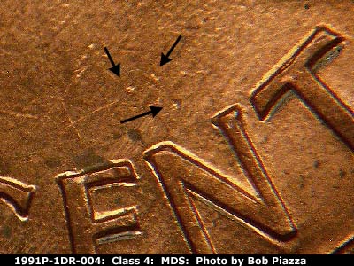 Die-stage B marker on 1991P•1DR•004 (1991 Doubled Die Reverse).