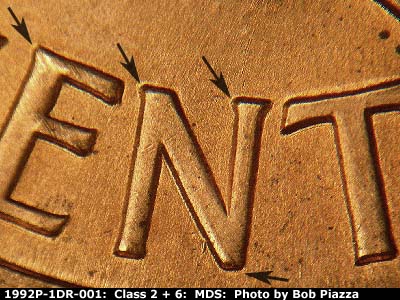 Die-stage B marker on 1992P•1DR•001 (1992 Doubled Die Reverse).