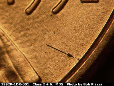 Die-stage B marker on 1992P•1DR•001 (1992 Doubled Die Reverse).