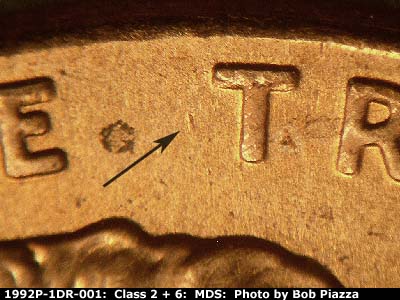 Die-stage B marker on 1992P•1DR•001 (1992 Doubled Die Reverse).