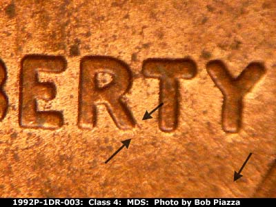 Die-stage B marker on 1992P•1DR•003 (1992 Doubled Die Reverse).
