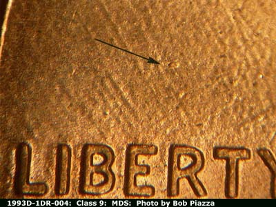 Die-stage B marker on 1993D•1DR•004 (1993 Doubled Die Reverse).
