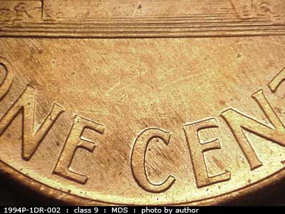 Die-stage B marker on 1994P•1DR•002 (1994 Doubled Die Reverse).