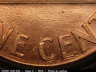 Die-stage B marker on 1994P•1DR•003 (1994 Doubled Die Reverse).