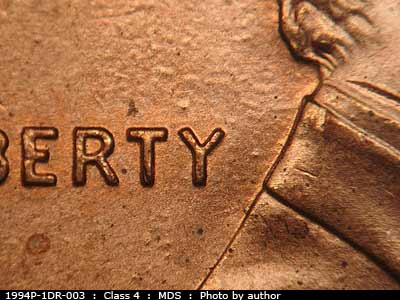 Die-stage B marker on 1994P•1DR•003 (1994 Doubled Die Reverse).