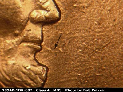Die-stage B marker on 1994P•1DR•007 (1994 Doubled Die Reverse).