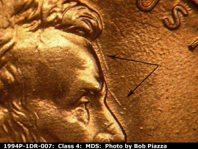 Die-stage B marker on 1994P•1DR•007 (1994 Doubled Die Reverse).