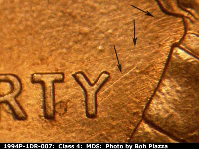 Die-stage B marker on 1994P•1DR•007 (1994 Doubled Die Reverse).