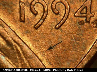 Die-stage B marker on 1994P•1DR•010 (1994 Doubled Die Reverse).