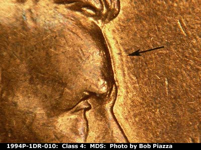 Die-stage B marker on 1994P•1DR•010 (1994 Doubled Die Reverse).