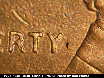Die-stage B marker on 1994P•1DR•010 (1994 Doubled Die Reverse).