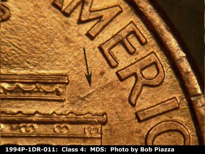 Die-stage B marker on 1994P•1DR•011 (1994 Doubled Die Reverse).