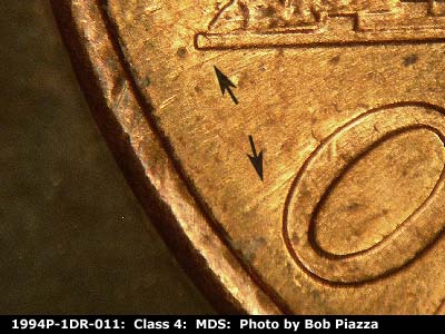 Die-stage B marker on 1994P•1DR•011 (1994 Doubled Die Reverse).