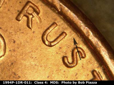 Die-stage B marker on 1994P•1DR•011 (1994 Doubled Die Reverse).