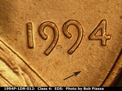 Die-stage A marker on 1994P•1DR•012 (1994 Doubled Die Reverse).