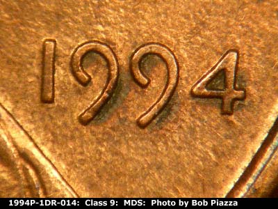 Die-stage B marker on 1994P•1DR•014 (1994 Doubled Die Reverse).