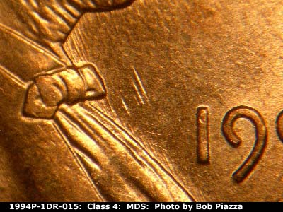 Die-stage B marker on 1994P•1DR•015 (1994 Doubled Die Reverse).