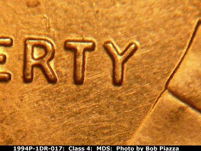 Die-stage B marker on 1994P•1DR•017 (1994 Doubled Die Reverse).