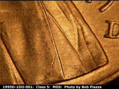 Die-stage B marker on 1995D•1DO•001 (1995 Doubled Die Obverse).