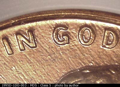 Die-stage B marker on 1995D•1DO•003 (1995 Doubled Die Obverse).