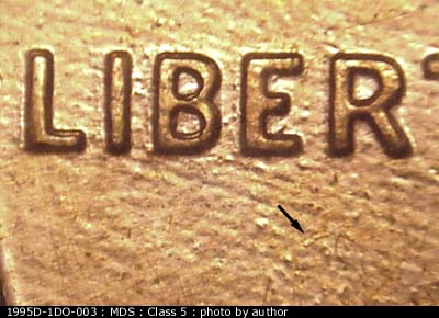 Die-stage B marker on 1995D•1DO•003 (1995 Doubled Die Obverse).