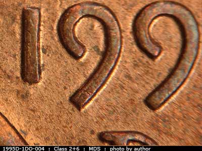 Die-stage B marker on 1995D•1DO•004 (1995 Doubled Die Obverse).