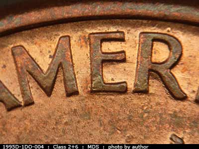 Die-stage B marker on 1995D•1DO•004 (1995 Doubled Die Obverse).