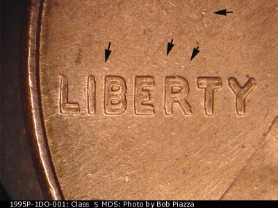 Die-stage B marker on 1995P•1DO•001 (1995 Doubled Die Obverse).