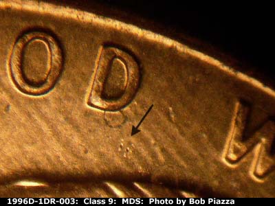 Die-stage B marker on 1996D•1DR•003 (1996 Doubled Die Reverse).