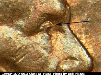Die-stage B marker on 1996P•1DO•001 (1996 Doubled Die Obverse).