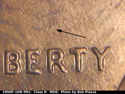 Die-stage B marker on 1996P•1DR•001 (1996 Doubled Die Reverse).