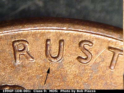 Die-stage B marker on 1996P•1DR•001 (1996 Doubled Die Reverse).