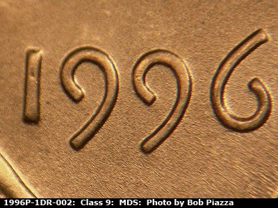 Die-stage B marker on 1996P•1DR•002 (1996 Doubled Die Reverse).