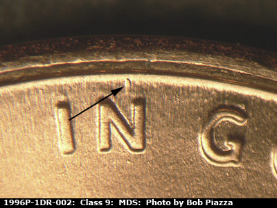 Die-stage B marker on 1996P•1DR•002 (1996 Doubled Die Reverse).