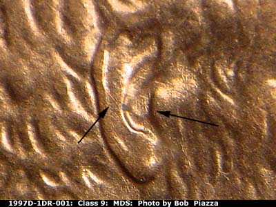Die-stage B marker on 1997D•1DR•001 (1997 Doubled Die Reverse).