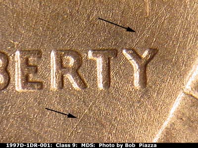 Die-stage B marker on 1997D•1DR•001 (1997 Doubled Die Reverse).