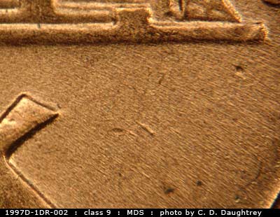 Die-stage B marker on 1997D•1DR•002 (1997 Doubled Die Reverse).