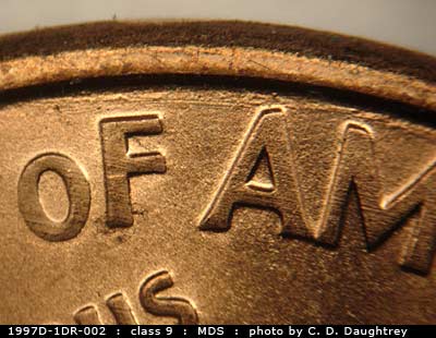Die-stage B marker on 1997D•1DR•002 (1997 Doubled Die Reverse).