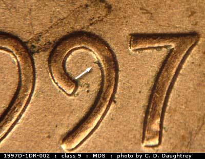 Die-stage B marker on 1997D•1DR•002 (1997 Doubled Die Reverse).