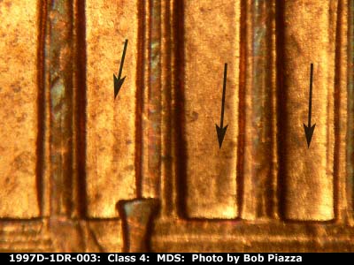 Die-stage B marker on 1997D•1DR•003 (1997 Doubled Die Reverse).