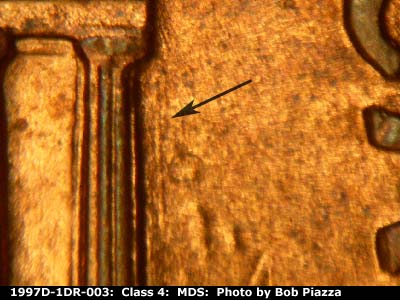 Die-stage B marker on 1997D•1DR•003 (1997 Doubled Die Reverse).