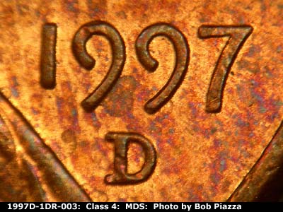 Die-stage B marker on 1997D•1DR•003 (1997 Doubled Die Reverse).