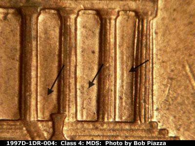 Die-stage B marker on 1997D•1DR•004 (1997 Doubled Die Reverse).