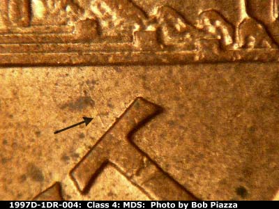 Die-stage B marker on 1997D•1DR•004 (1997 Doubled Die Reverse).