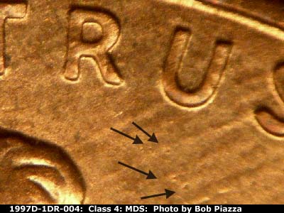 Die-stage B marker on 1997D•1DR•004 (1997 Doubled Die Reverse).