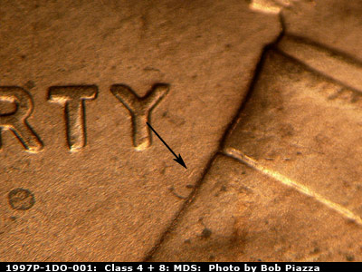 Die-stage B marker on 1997P•1DO•001 (1997 Doubled Die Obverse).